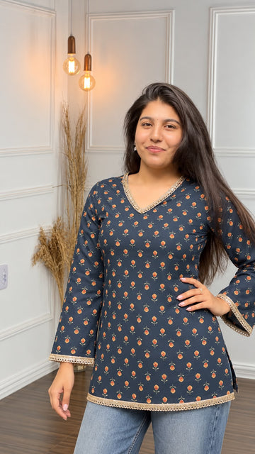 Zeenat Lace Bell-Sleeve Short Kurti – teal blue floral print kurti with gold lace V-neck, front view